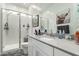 Clean bathroom with walk-in shower, modern vanity, and gray countertop at 2963 E Birdsong Ave, San Tan Valley, AZ 85143