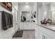 Modern bathroom with a large vanity, walk-in shower, and gray tile flooring at 2963 E Birdsong Ave, San Tan Valley, AZ 85143