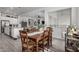 Farmhouse style dining table with six chairs and large clock at 2963 E Birdsong Ave, San Tan Valley, AZ 85143