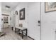 Inviting entryway with a bench, storage cabinet, and neutral color palette at 2963 E Birdsong Ave, San Tan Valley, AZ 85143