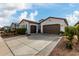 Two-car garage with driveway and nicely landscaped yard at 2963 E Birdsong Ave, San Tan Valley, AZ 85143