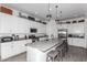 Modern kitchen with white cabinets, island, and stainless steel appliances at 2963 E Birdsong Ave, San Tan Valley, AZ 85143