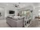 Living room with sectional sofa, sliding glass doors to patio at 2963 E Birdsong Ave, San Tan Valley, AZ 85143