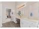 Double vanity bathroom with walk-in shower and view into bedroom at 302 S Laguna Dr, Gilbert, AZ 85233