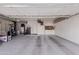 Large garage with workbenches, storage, and room for two cars at 302 S Laguna Dr, Gilbert, AZ 85233