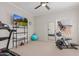 Home gym with treadmill, elliptical, and plenty of floor space at 302 S Laguna Dr, Gilbert, AZ 85233