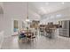 Bright kitchen with an eat-in area and French doors leading outside at 302 S Laguna Dr, Gilbert, AZ 85233