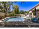 Inviting kidney-shaped pool with ample deck space for relaxing at 302 S Laguna Dr, Gilbert, AZ 85233