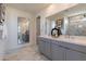 Elegant bathroom with double vanity and marble flooring at 3238 W Garnet St, San Tan Valley, AZ 85144