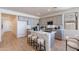 Modern kitchen with gray cabinets, marble island, and hardwood floors at 3238 W Garnet St, San Tan Valley, AZ 85144