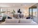 Light-filled living room with beige sofa and sliding glass doors at 3238 W Garnet St, San Tan Valley, AZ 85144