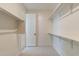 Spacious walk-in closet with hanging rods and shelves at 3238 W Garnet St, San Tan Valley, AZ 85144