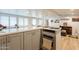 Modern gray kitchen cabinets and a built-in oven at 331 E Tuckey Ln, Phoenix, AZ 85012