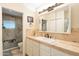 Bathroom boasts a large vanity, beige tile, and a shower/tub combo at 331 E Tuckey Ln, Phoenix, AZ 85012