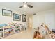 bedroom with built-in shelving, a rocking horse and fun wall art at 331 E Tuckey Ln, Phoenix, AZ 85012