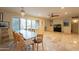 Bright dining room with tile floor, large windows, and a chandelier at 331 E Tuckey Ln, Phoenix, AZ 85012