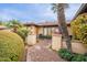 Inviting entryway with brick pathway, lush landscaping, and elegant lighting at 331 E Tuckey Ln, Phoenix, AZ 85012