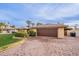 Home featuring a two-car garage and a nicely landscaped front yard at 331 E Tuckey Ln, Phoenix, AZ 85012