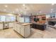 Modern kitchen with a large island, white cabinetry, and tile flooring at 331 E Tuckey Ln, Phoenix, AZ 85012