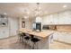 White kitchen with wood countertop island and stainless steel appliances at 331 E Tuckey Ln, Phoenix, AZ 85012