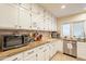 Kitchen boasts granite countertops and ample white cabinetry at 331 E Tuckey Ln, Phoenix, AZ 85012