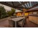 Patio dining area with pergola and seating at 331 E Tuckey Ln, Phoenix, AZ 85012