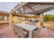 Patio with dining table and built-in grill at 331 E Tuckey Ln, Phoenix, AZ 85012