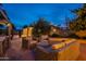 Evening view of backyard patio with wicker furniture and a view of the house at 331 E Tuckey Ln, Phoenix, AZ 85012