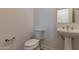 Clean bathroom with pedestal sink and toilet at 35775 N Zinc Dr, San Tan Valley, AZ 85144