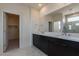 Modern bathroom with double vanity and marble floors at 35775 N Zinc Dr, San Tan Valley, AZ 85144