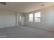 Spacious bedroom with carpet and multiple windows at 35775 N Zinc Dr, San Tan Valley, AZ 85144