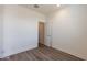 Bright bedroom with wood-look flooring and an adjacent closet at 35775 N Zinc Dr, San Tan Valley, AZ 85144