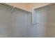 Corner closet with hanging rods and shelving at 35775 N Zinc Dr, San Tan Valley, AZ 85144