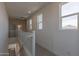 Upstairs hallway with carpeting and multiple windows at 35775 N Zinc Dr, San Tan Valley, AZ 85144