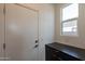 Laundry room with dark countertop, door and window at 35775 N Zinc Dr, San Tan Valley, AZ 85144