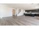 Bright and airy living room with hardwood floors and modern kitchen at 35775 N Zinc Dr, San Tan Valley, AZ 85144