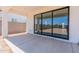 Covered patio with sliding glass doors leading to backyard at 35775 N Zinc Dr, San Tan Valley, AZ 85144