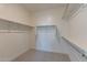 Spacious walk-in closet with double hanging rods at 35775 N Zinc Dr, San Tan Valley, AZ 85144