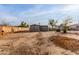 Large backyard with dirt and a small stone path at 3640 W Garfield St, Phoenix, AZ 85009