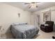 Simple bedroom with a double bed and ceiling fan at 3640 W Garfield St, Phoenix, AZ 85009