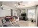 Living room with sofa, TV, and ceiling fan at 3640 W Garfield St, Phoenix, AZ 85009