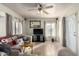 Living room with sofa, TV, and ceiling fan at 3640 W Garfield St, Phoenix, AZ 85009