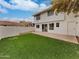 Private backyard with artificial turf and patio at 3835 E Kent Dr, Phoenix, AZ 85044