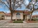 House exterior showcasing a charming curb appeal with a well-maintained lawn and landscaping at 3835 E Kent Dr, Phoenix, AZ 85044