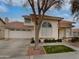 House exterior showcasing a two-story home with a well maintained lawn at 3835 E Kent Dr, Phoenix, AZ 85044