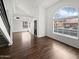 Bright living room with hardwood floors and a view of the neighborhood at 3835 E Kent Dr, Phoenix, AZ 85044