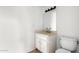 Clean bathroom with a single sink vanity and a toilet at 4303 W Solano N Dr, Glendale, AZ 85301