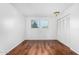 Spacious bedroom featuring wood-look floors and built-in closet at 4303 W Solano N Dr, Glendale, AZ 85301