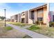 Row of two-story townhomes with a shared walkway and landscaping at 4303 W Solano N Dr, Glendale, AZ 85301