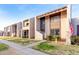 Row of two-story townhomes with a shared walkway and landscaping at 4303 W Solano N Dr, Glendale, AZ 85301